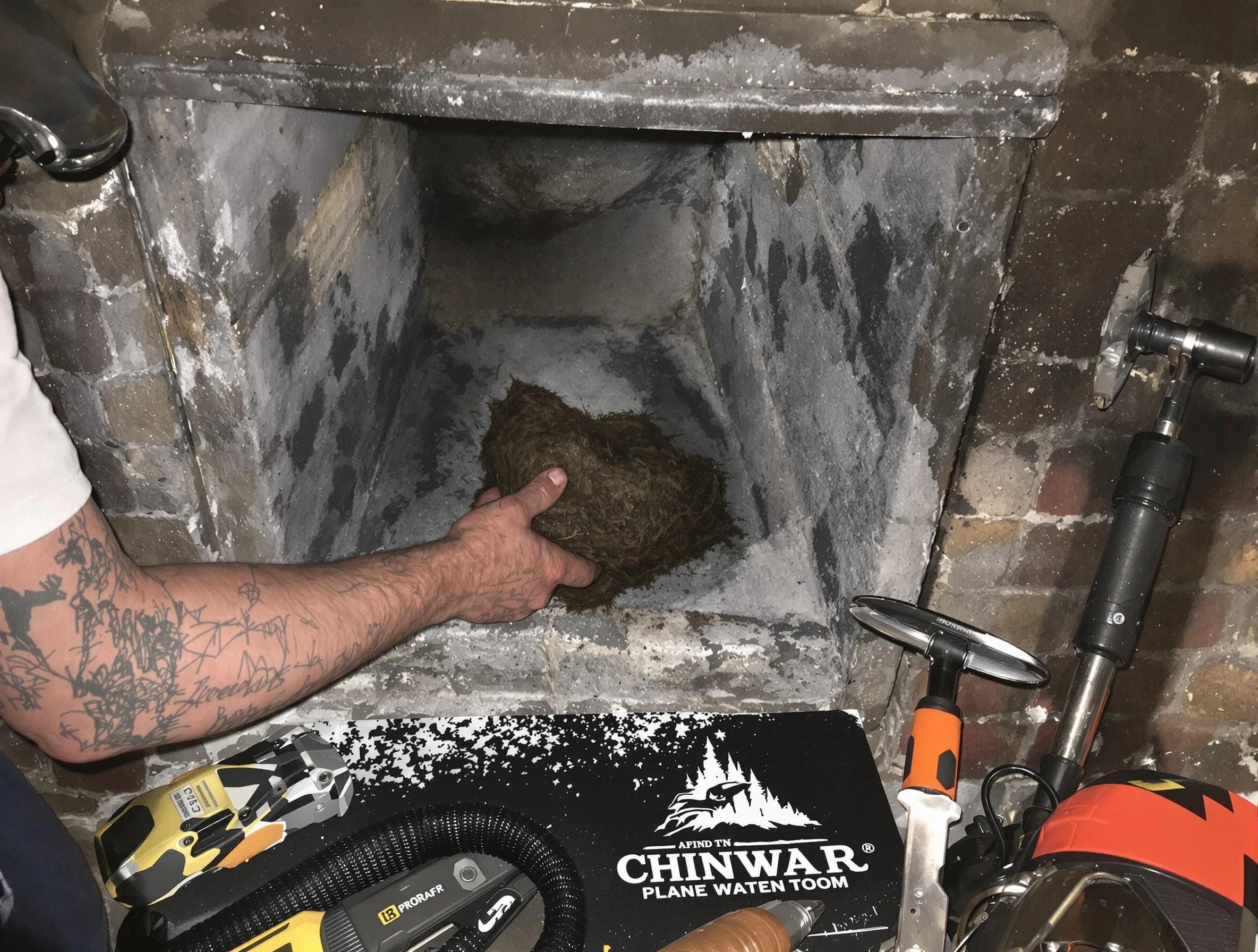 Castle Pines Chimney Sweep safely removing debris and screening chimney in Castle Pines, CO